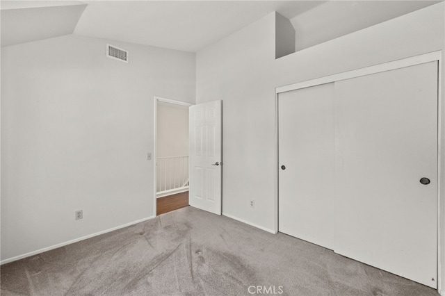 1336 Granada St, Upland, CA 91784 - unfurnished bedroom with carpet floors, vaulted ceiling, and a closet