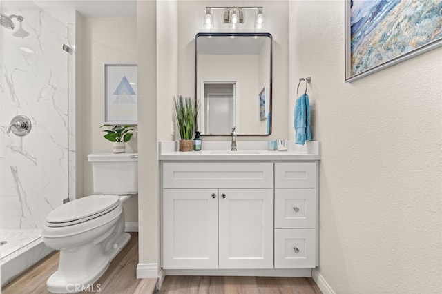 1336 Granada St, Upland, CA 91784 - full bath featuring a marble finish shower, wood finished floors, vanity, and a textured wall