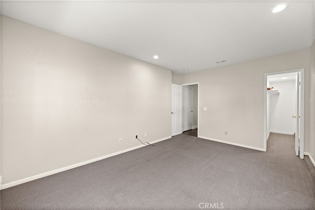 1336 Granada St, Upland, CA 91784 - unfurnished bedroom featuring recessed lighting, dark colored carpet, and a walk in closet