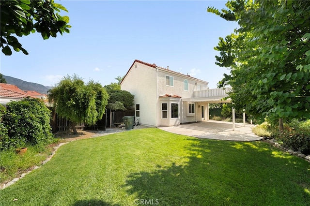 1336 Granada St, Upland, CA 91784 - rear view of house with a tile roof, a patio area, stucco siding, and a fenced backyard