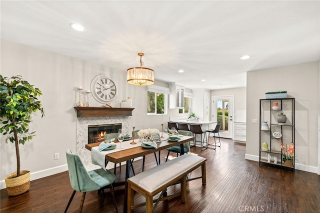 1336 Granada St, Upland, CA 91784 - dining room with dark wood-style flooring, a glass covered fireplace, recessed lighting, and a chandelier
