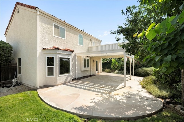1336 Granada St, Upland, CA 91784 - back of house featuring a tiled roof, a patio area, and stucco siding