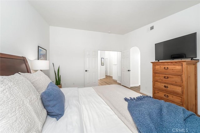 33144 Ocean Rdg, Dana Point, CA 92629 - bedroom with arched walkways and wood finished floors