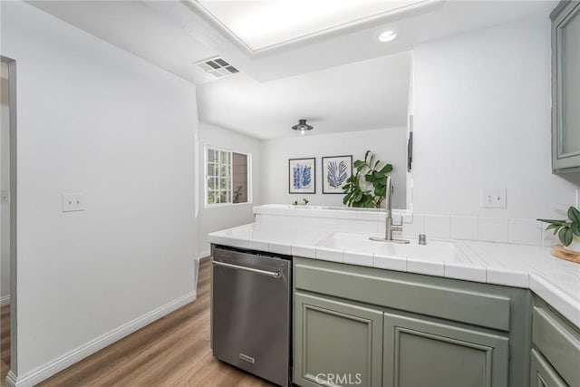 33144 Ocean Rdg, Dana Point, CA 92629 - kitchen featuring dishwasher, light wood-style floors, a peninsula, tile counters, and recessed lighting