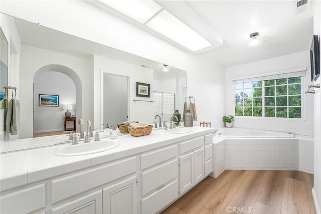 33144 Ocean Rdg, Dana Point, CA 92629 - full bath with wood finished floors, double vanity, a garden tub, and a shower with shower door