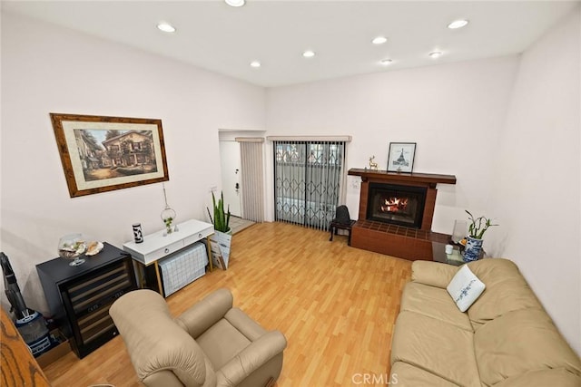 513 N Chandler Ave Unit E, Monterey Park, CA 91754 - living area with light wood-type flooring, a lit fireplace, and recessed lighting