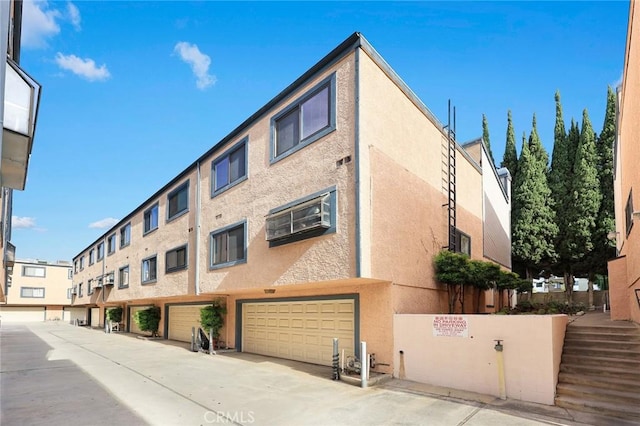 513 N Chandler Ave Unit E, Monterey Park, CA 91754 - view of building exterior featuring an attached garage