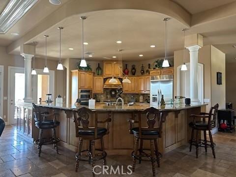 17134 Joshua Rd, Apple Valley, CA 92307 - kitchen featuring decorative backsplash, appliances with stainless steel finishes, a kitchen breakfast bar, recessed lighting, and hanging light fixtures