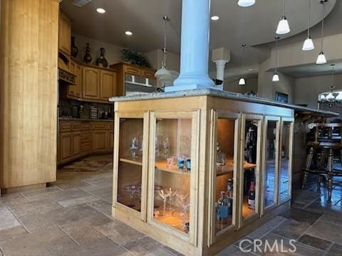 17134 Joshua Rd, Apple Valley, CA 92307 - kitchen with decorative columns, decorative light fixtures, stone tile floors, and recessed lighting