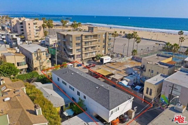 aerial view featuring a water view and a view of the beach