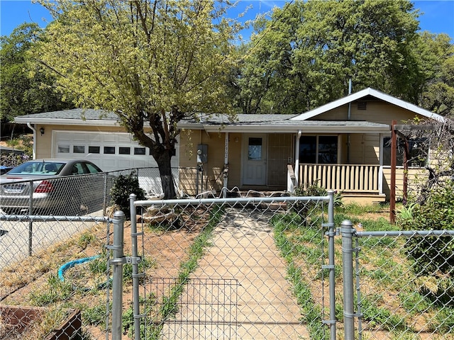 view of front of property with covered porch and a garage