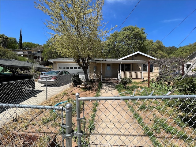 view of front facade featuring covered porch and a garage