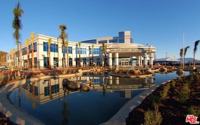 view of building exterior featuring a water view