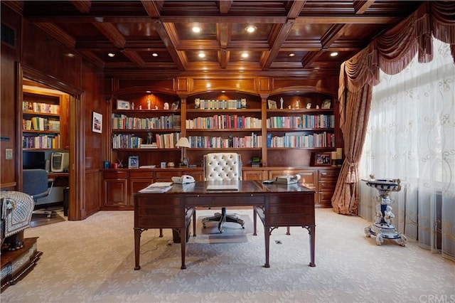 office area with built in features, beam ceiling, coffered ceiling, and light colored carpet