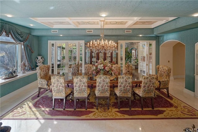 dining area with coffered ceiling, light tile floors, a notable chandelier, and a textured ceiling