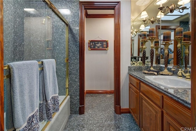 bathroom featuring shower / bath combination with glass door, a chandelier, and oversized vanity