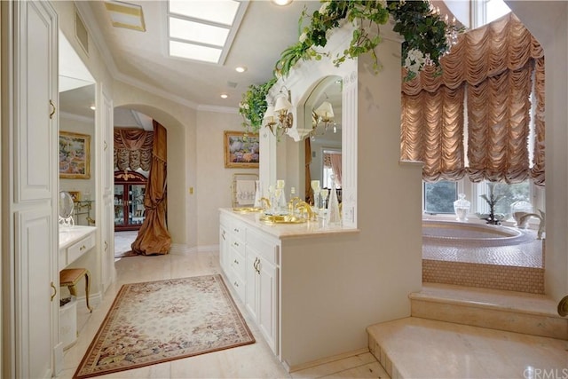 bathroom with plenty of natural light, crown molding, tiled bath, tile floors, and vanity