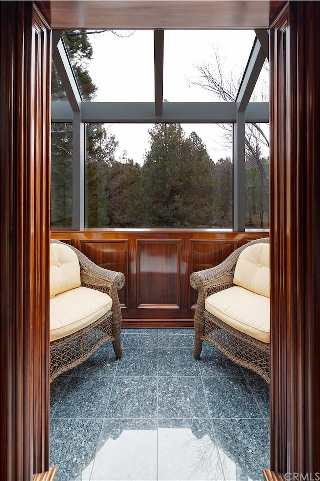 sunroom / solarium featuring a healthy amount of sunlight