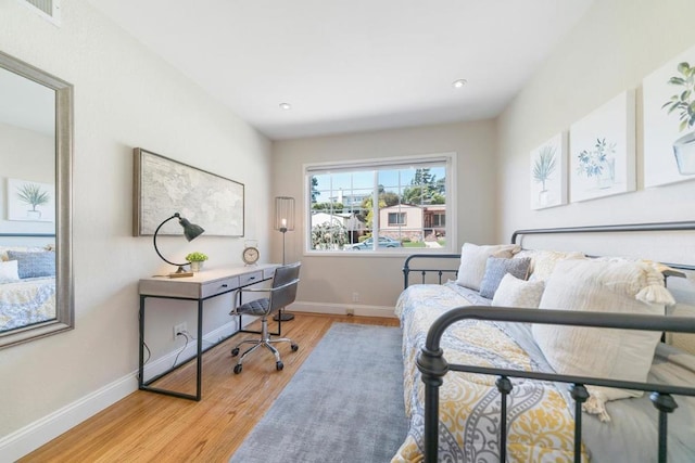 bedroom with light hardwood / wood-style flooring