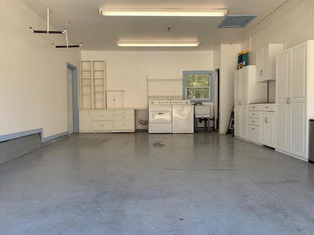 garage with washer and dryer