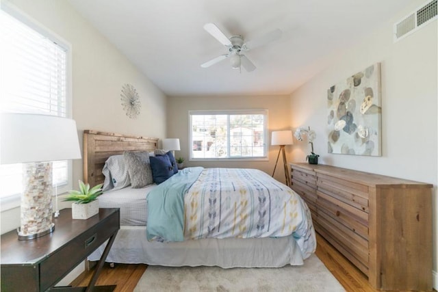 bedroom featuring ceiling fan and light hardwood / wood-style floors