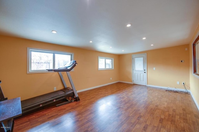 workout room with wood-type flooring