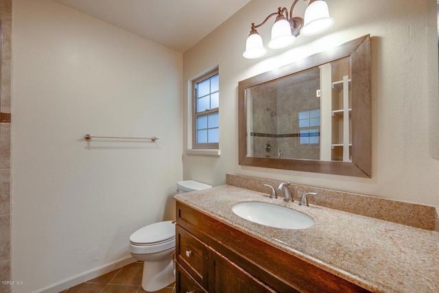 bathroom featuring vanity, toilet, and tile patterned flooring