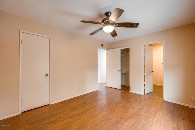 unfurnished bedroom with ceiling fan and light hardwood / wood-style floors