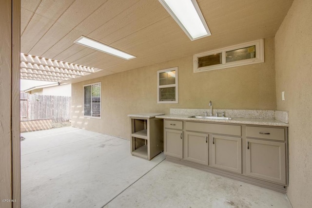 interior space featuring sink, area for grilling, and a pergola