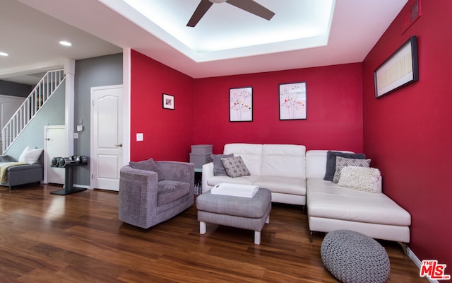 living room featuring ceiling fan and wood-type flooring