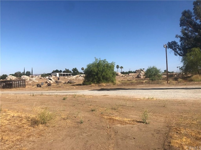 view of yard with a rural view