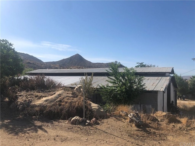 view of property exterior featuring a mountain view