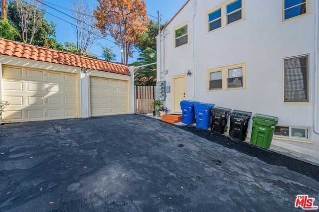 view of side of property with a garage