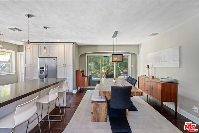 dining room featuring dark wood-type flooring