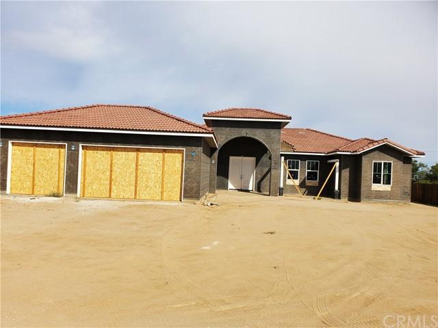 mediterranean / spanish home featuring a garage