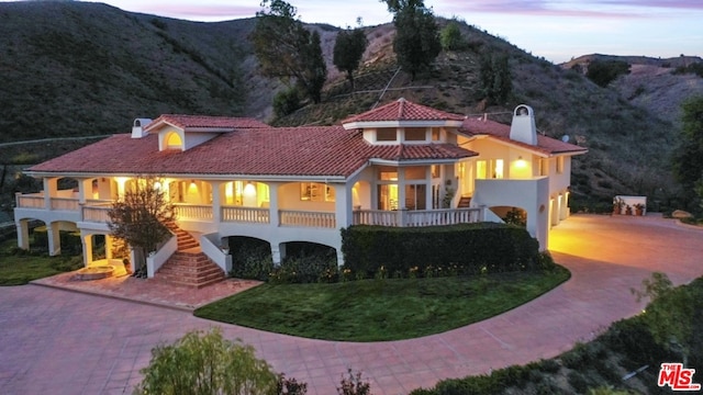 mediterranean / spanish home with a mountain view