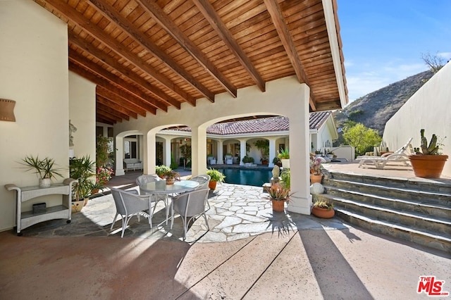 view of patio / terrace with a mountain view