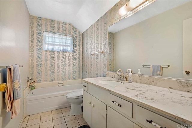 bathroom featuring lofted ceiling, tile flooring, toilet, and oversized vanity