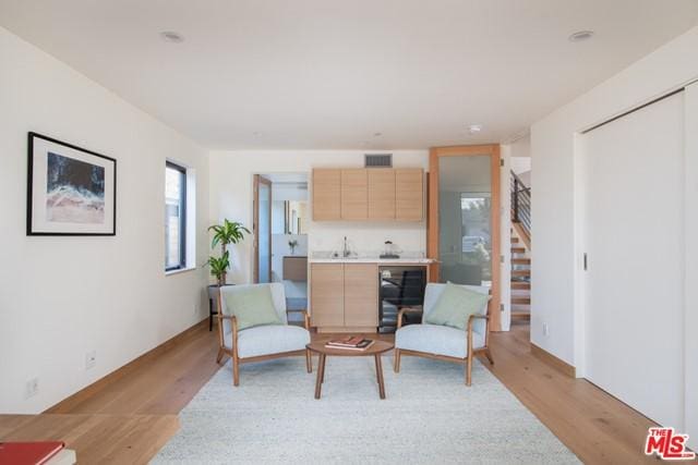 sitting room with light wood-type flooring