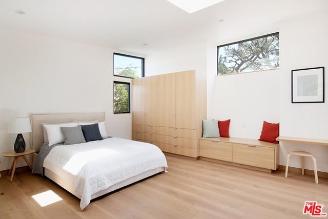 bedroom with light hardwood / wood-style floors