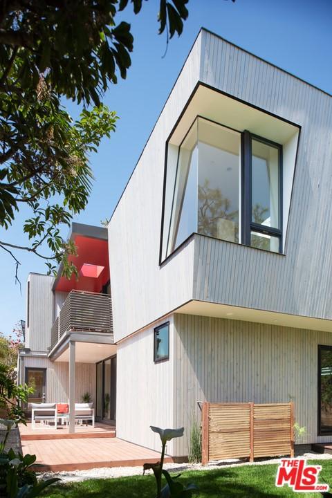 rear view of house with a balcony and a deck