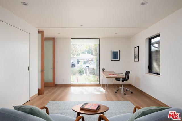 living room featuring a healthy amount of sunlight and light wood-type flooring