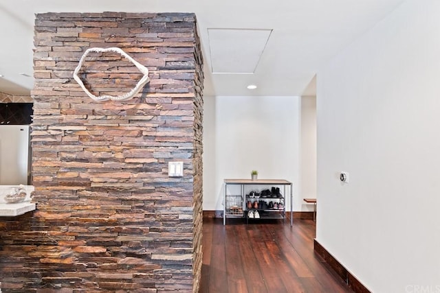 hallway with dark hardwood / wood-style flooring