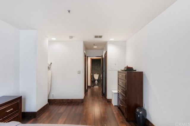 hallway featuring dark hardwood / wood-style flooring