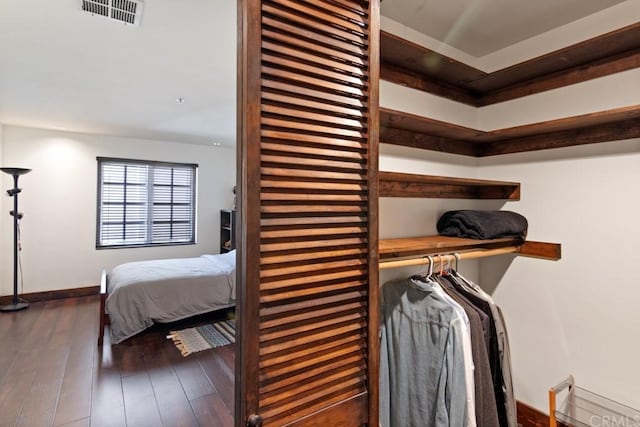 bedroom featuring dark wood-type flooring