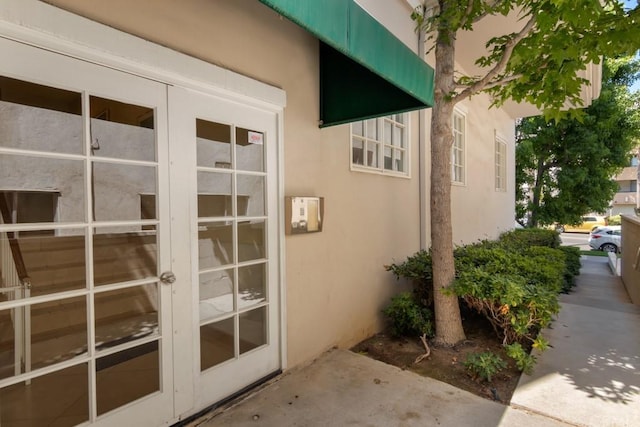 view of side of home with french doors