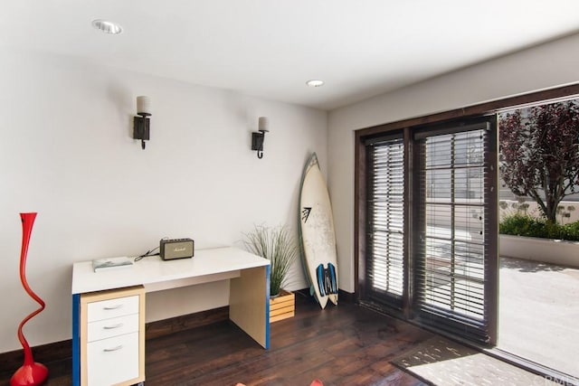 office space with dark wood-type flooring