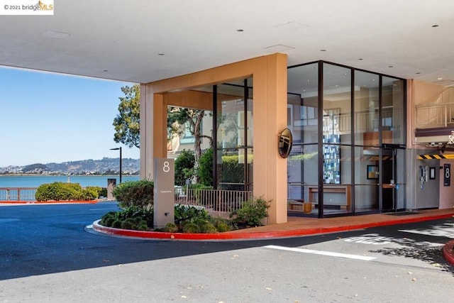 entrance to property featuring a water and mountain view