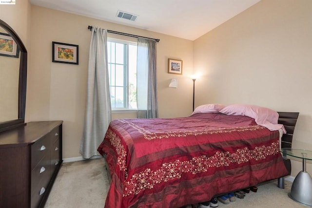 bedroom with light carpet