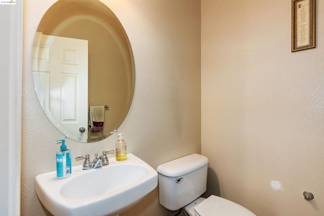 bathroom with toilet and sink